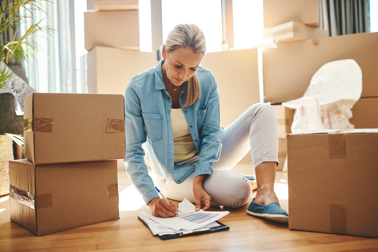 Woman working on her to-do list for her move to the US