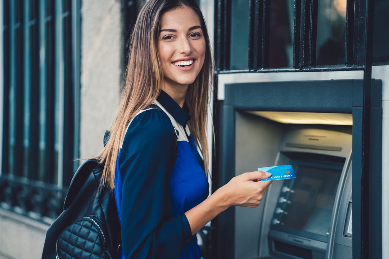 Using an ATM at the bank